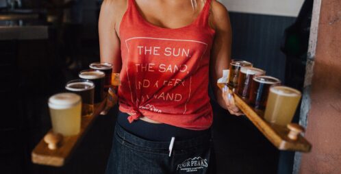 Waitress serves beer flights